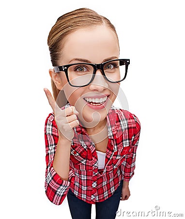 Smiling teenager in eyeglasses with finger up Stock Photo