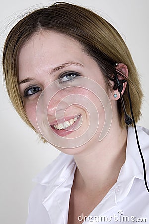 A smiling telesales girl Stock Photo