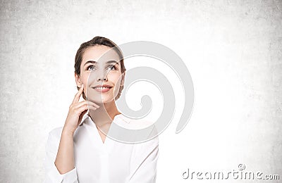 Smiling thoughtful young businesswoman, mock up Stock Photo