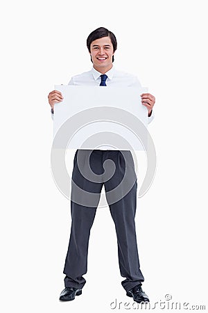 Smiling tradesman holding blank sign Stock Photo