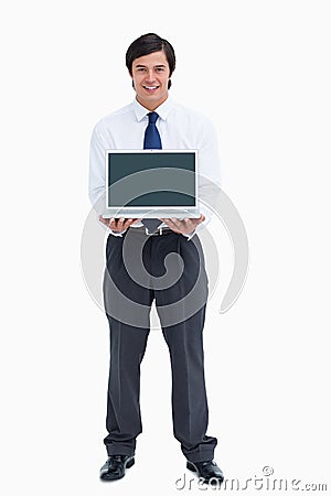 Smiling tradesman presenting screen of his laptop Stock Photo