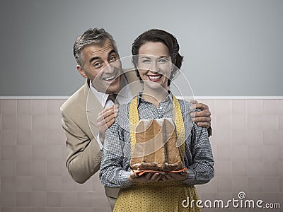 Smiling vintage couple with cake Stock Photo