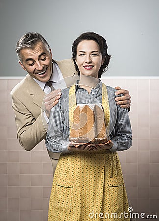 Smiling vintage couple with cake Stock Photo