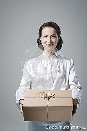 Smiling vintage woman with mail package Stock Photo