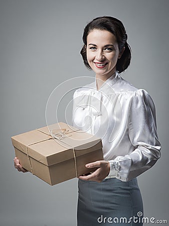 Smiling vintage woman with mail package Stock Photo