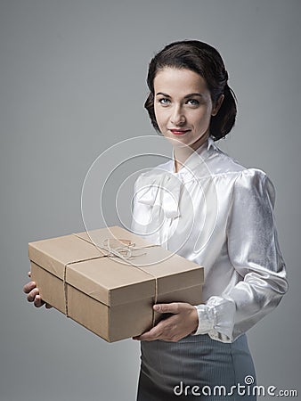 Smiling vintage woman with mail package Stock Photo