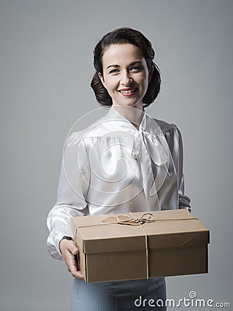 Smiling vintage woman with mail package Stock Photo