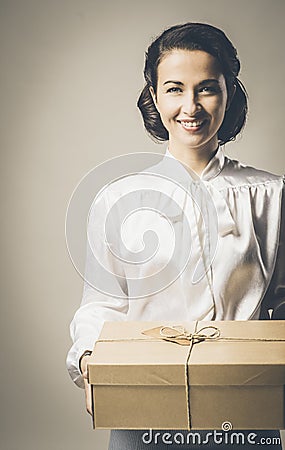 Smiling vintage woman with mail package Stock Photo