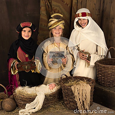 Smiling wisemen in christmas nativity scene Stock Photo