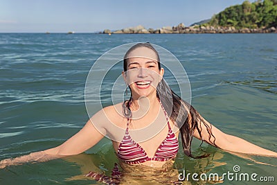 Smiling woman on the beach, on a sunny day, summer Editorial Stock Photo