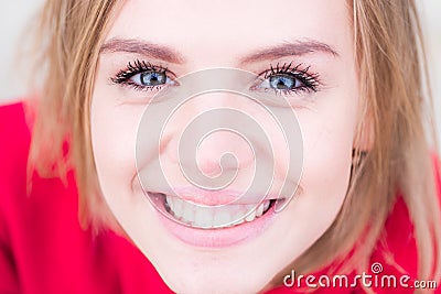 Smiling woman. Beuty face. Close-up beauty face of young beutiful model woman touching face healthy skin. Natural lips Stock Photo