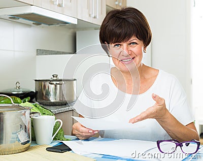 smiling woman bills Stock Photo