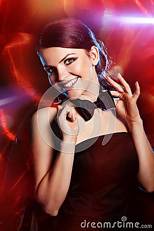 Smiling woman with black bow-tie Stock Photo