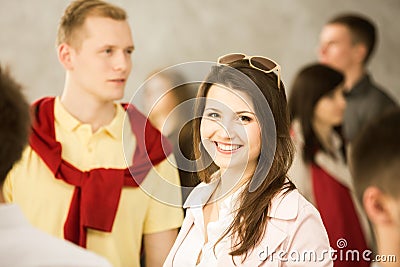 Smiling woman in the crowd Stock Photo