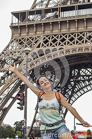 Smiling woman at Effiel Tower Stock Photo