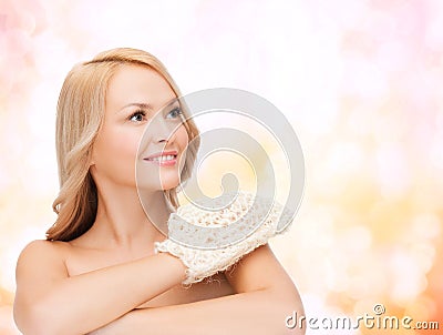 Smiling woman with exfoliation glove Stock Photo