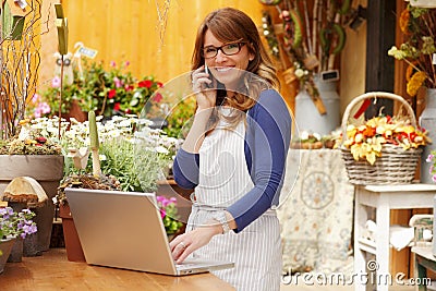 Smiling Woman Florist, Small Business Flower Shop Owner Stock Photo