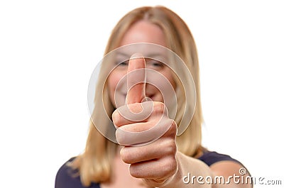 Smiling woman giving a thumbs up of approval Stock Photo