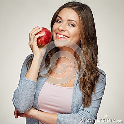 Smiling woman with healthy teeth holdinh red apple. Stock Photo