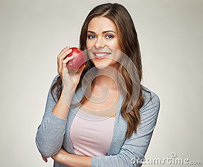 Smiling woman with healthy teeth holdinh red apple. Stock Photo