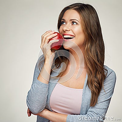 Smiling woman with healthy teeth holdinh red apple. Stock Photo