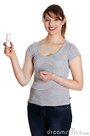 Smiling woman holding energy-saving bulb Stock Photo