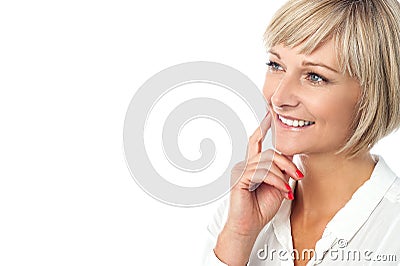 Smiling woman imagining something Stock Photo