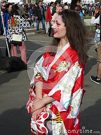 Smiling Woman in a Kimono Editorial Stock Photo