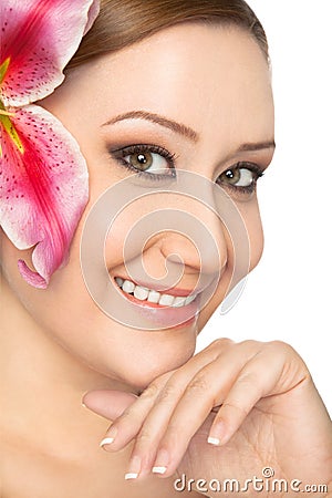 Smiling woman lily in hair Stock Photo