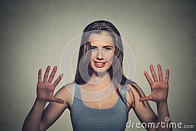 Smiling woman making five times sign gesture with hands fingers Stock Photo