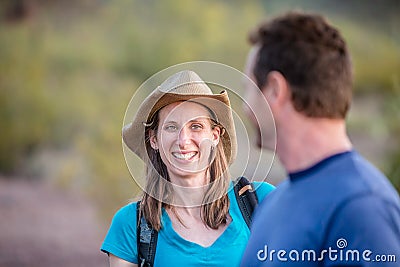 Smiling Woman on Nature Hike Stock Photo