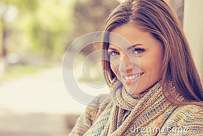 Smiling woman with perfect smile and white teeth in a park Stock Photo