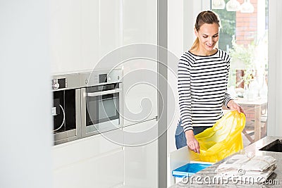 Woman preparing bin for segregation Stock Photo