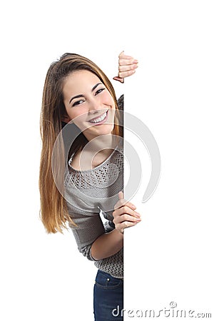 Smiling woman presenting and holding a blank sign Stock Photo