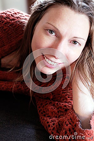 relaxing woman Smiling at home on a sofa holidays no stress Stock Photo