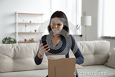 Asian female call to thank for surprise received by mail Stock Photo