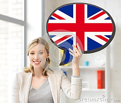 Smiling woman with text bubble of british flag Stock Photo