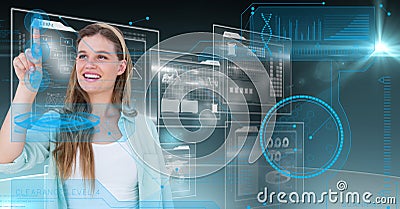 Smiling woman touching digitally futuristic screen Stock Photo