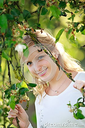 Smiling Woman Through Tree Stock Photo