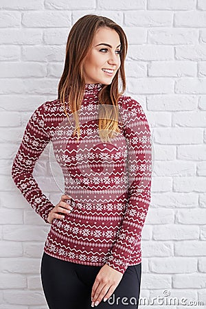 Smiling woman wearing warm sweater Stock Photo