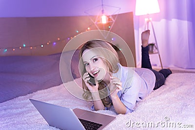 Smiling woman working and talking on the phone Stock Photo