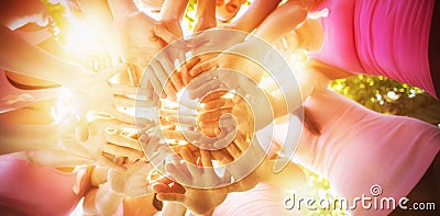 Smiling women organising event for breast cancer awareness Stock Photo