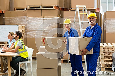 Smiling workers looking at camera Stock Photo