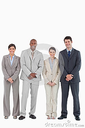 Smiling young businessteam standing together Stock Photo