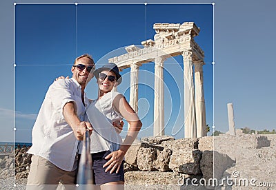 Smiling young couple take a selfie photo on antique ruins Stock Photo