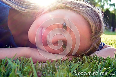 Smiling young face of girl. Nice child rejoices Stock Photo