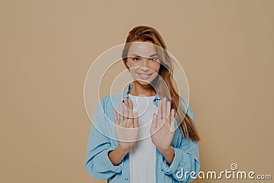 Smiling young female model with stright long hair wearing oversized blue shirt Stock Photo
