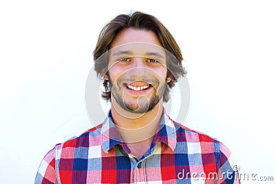 Smiling young man with beard standing against white background Stock Photo