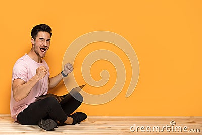 Smiling young man with laptop computer. Stock Photo