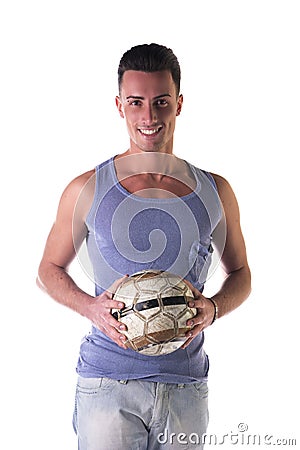 Smiling young man in tanktop holding soccer ball Stock Photo